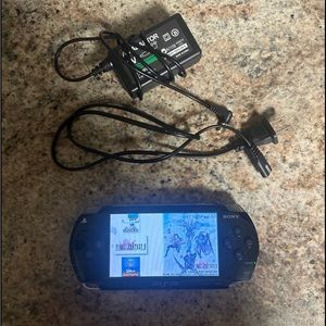Sony PSP 1001 Console Bundle with Games, Charger, 128GB SD, and New Battery
